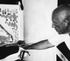 Examining rooster-themed paintings by Pablo Picasso
